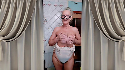 An Old Woman Masturbates Passionately in the Kitchen in Front of the Camera