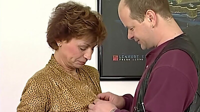 Granny moans in pleasure as a monster dildo is shoved into her pussy